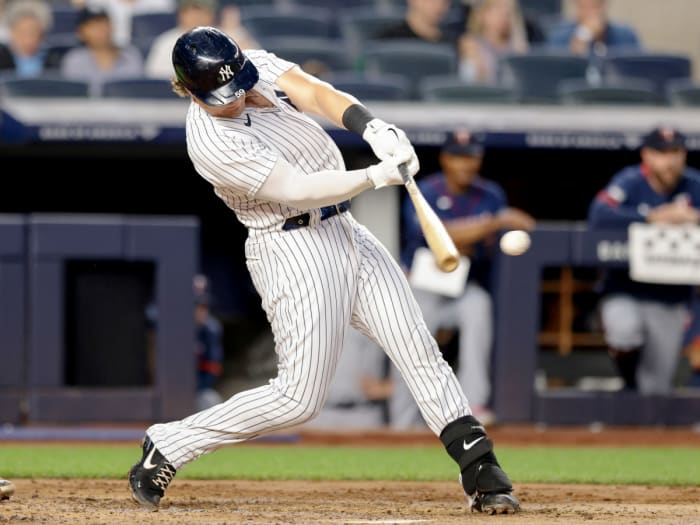 Aug 20, 2021; Bronx, New York, USA; New York Yankees first baseman Luke Voit (59) hits a single during the second inning against the Minnesota Twins at Yankee Stadium.